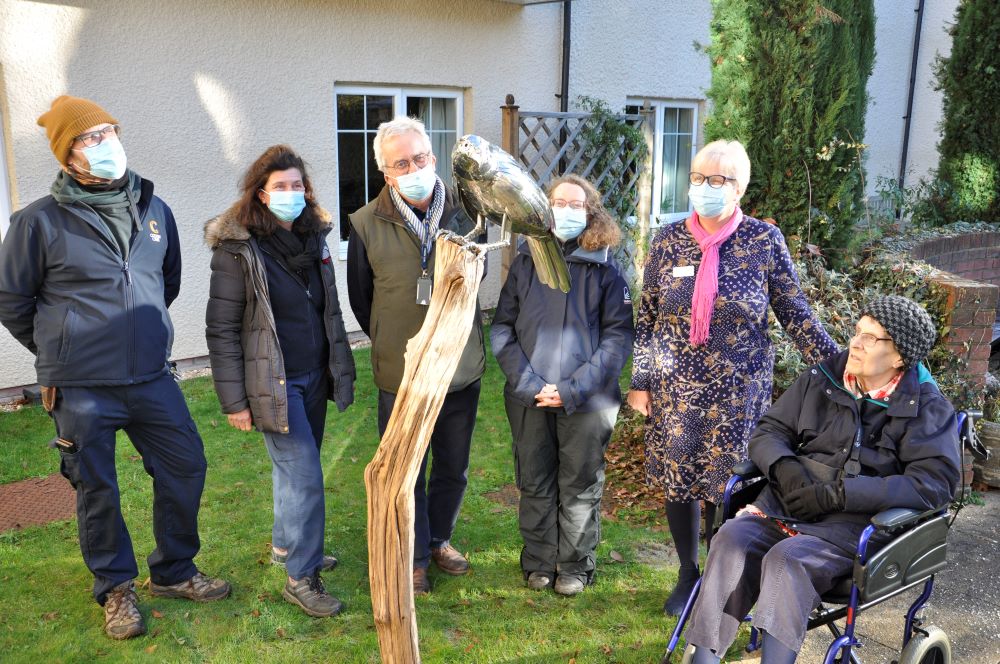 with the falcon in the Braemar Lodge garden, members of Colten Care gardening team 